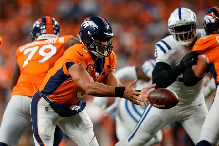Denver Broncos quarterback Russell Wilson (3) shovel passes the ball in the first quarter against the Indianapolis Colts at Empower Field at Mile High.